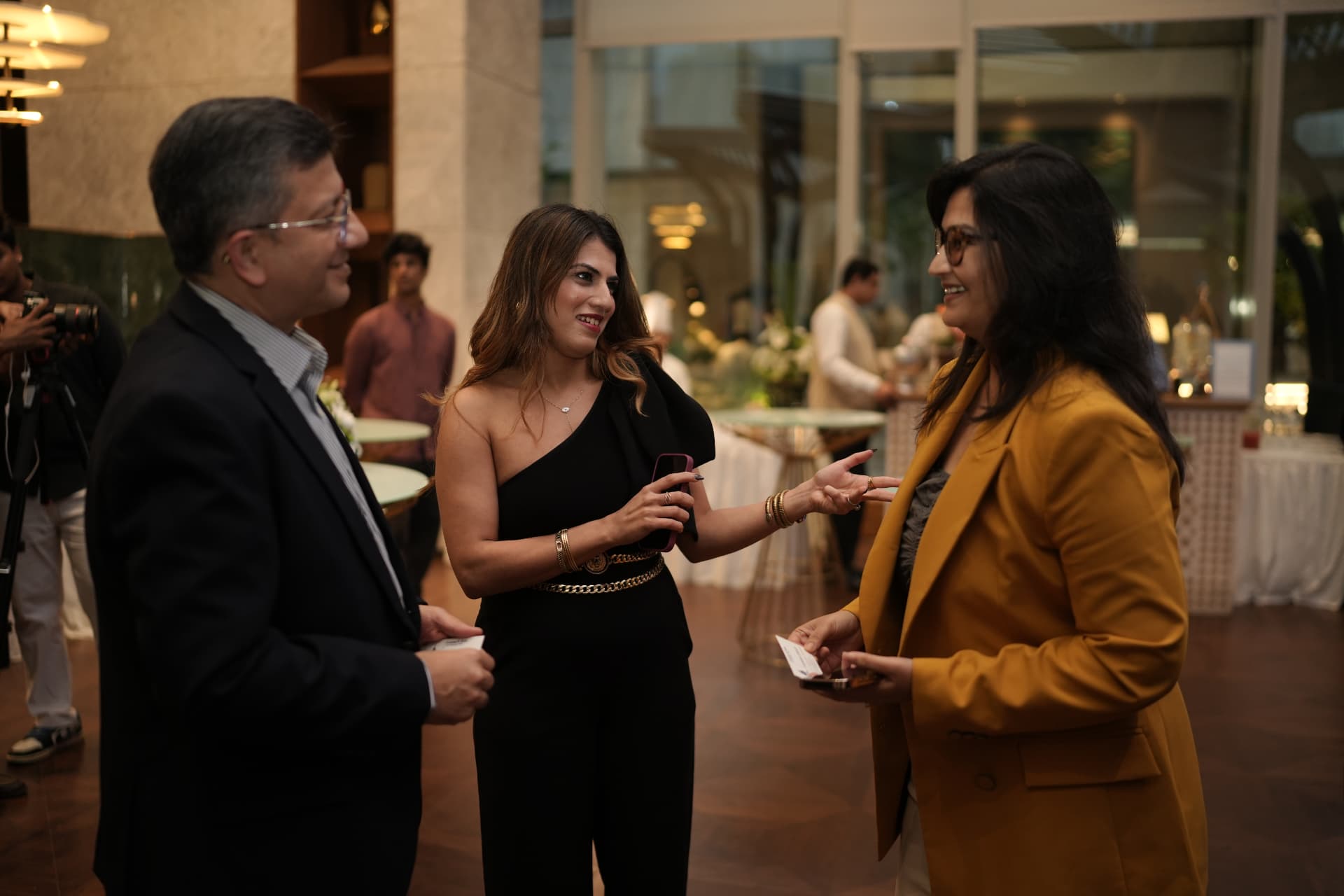 Guests exchanging cards at an Encubay dinner